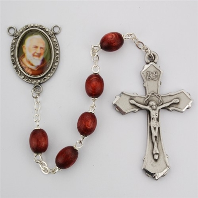 Saint Padre Pio rosary has 6X8 brown oval wood beads and an image of St. Padre Pio for a rosary center and a pewter crucifix. Gift boxed