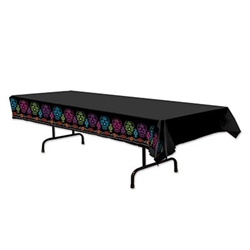 The Day Of The Dead Tablecover is a necessary decoration for your buffet or serving tables. Black plastic is accented with colorful designs of sugar skulls and flowers along each side. Printed one side. One table cover per package.