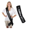 The Glittered Birthday Girl Satin Sash is black with Birthday Girl displayed in silver glittery writing. It is decorated with stars at both ends. Measures 33 inches long and 4 inches wide. One per package. No returns.