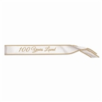 The 100 Years Loved Satin Sash is white with 100 Years Loved displayed in gold lettering. Measures 33 inches long and 4 inches wide. Contains one per package. No returns.