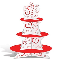The Valentine Cupcake Stand is made of white cardstock and decorated with red hearts with three red tiers. Measures 16 inches tall. Bottom tier - approx 12 in, middle tier - approx 9 in, and top tier - approx 6 1/4 in. One per pack. Assembly required.