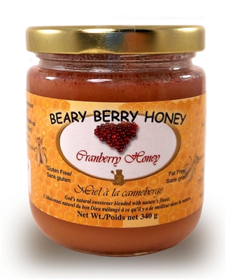 Creamed honey mixed with natural cranberries .