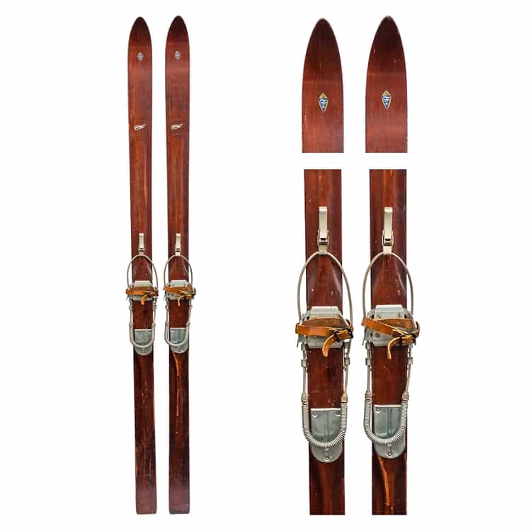 The ski tips have a dark shadow that are not on the actual skis. The shine on the tails are reflection and also not on the skis. 1940s J.C. Higgins Ridge Top Vintage Downhill Skis with Bear Trap and Cable Bindings