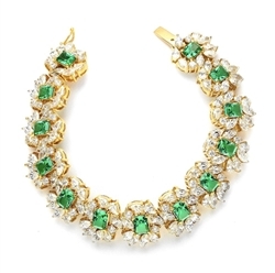 7" long Diamond Essence Bracelet with Emerald cut 13 Emerald Essence,each 1ct, surrounded by Marquie, Pear and Round stones. Appx. 38.0 Cts. T.W. set in 14K Solid Yellow Gold.