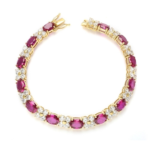 7" long Designer Bracelet with 1.25 Cts. each Oval cut Ruby Essence and Round Diamond Essence Stones. Appx. 27.0 Cts. T.W. set in 14K Gold.