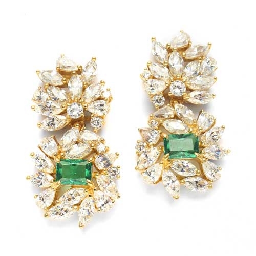 Designer earrings, just perfect for special occasions. Diamond Essence Emerald cut Emerald Essence, 1 ct. stone set in four prongs and surrounded by Marquise, Pear and Round Brilliant Essence stones in artistic floral design. 6.5 cts.T.W.