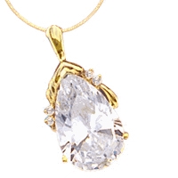 14K Solid Yellow Gold Pendant, 18 Carats T.W., with Pear Cut jewel and four Melee accents.The Pear cut stone is 22x44mm. In the back the bail has a snap on so that it can be worn as Pearl Enhancer on a Pearl Necklace.
