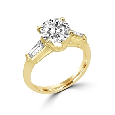 14K Solid Yellow Gold Diamond Essence engagement ring. 2.0 ct.round brilliant stones and delicate baguette on each side. 2.50 cts.t.w. Perfect for the occassion.