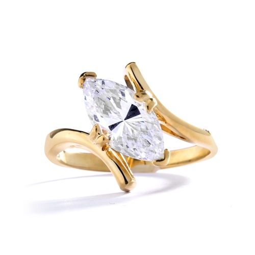 Solitaire Ring with artistically set  Diamond Essence Marquise in prong setting. 1.5 Cts. T.W. set in 14K Solid Yellow Gold.