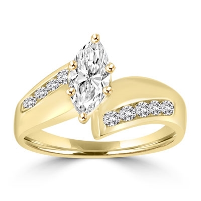 Ring with 1 carat marquise cut stone in middle and round stones each side