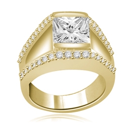 A unique contemporary Ring featuring a channel set 2 Ct. Princess Cut Diamond Essence Masterpiece with a melee of Round Cut accents. Thoroughly impressive 2.75 Cts.T.W. in 14K Solid Gold.