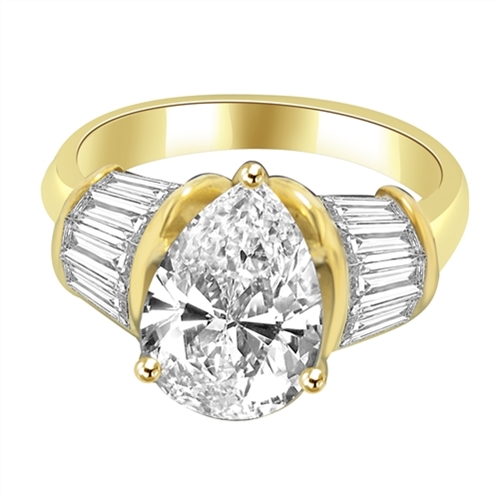 Majestic Pear cut Diamond Essence ring. 3 carat Pear center encircled by baguettes accents on either side. 5.0 cts.t.w. in 14K Solid Gold.