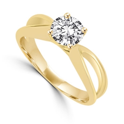 This Ring Is a sureshot hit with jewelry conossieurs. 0.75 Ct. Round Brilliant Masterpiece is set exquisitely on a cross curve band. In 14k Solid Yellow Gold.