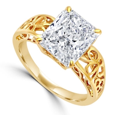 In this finely created ring, a 4 Ct. Radiant Emerald White Brilliant Stone is crafted atop an ethic set wide band. In 14k Solid Yellow Gold.
