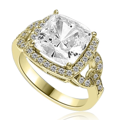 Diamond  Essence designer ring 4.0 cts. Cushion cut Diamond essence set high in the center with melee around and on the band. 4.5 cts.t.w in 14K Solid Gold.