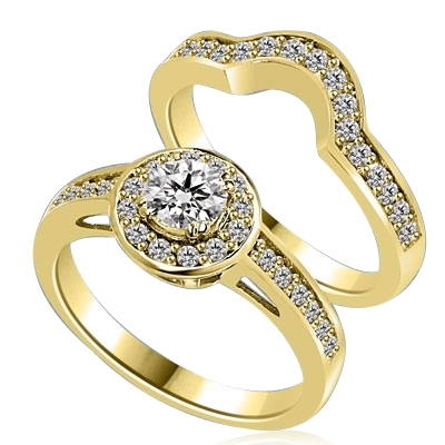 An attractive Wedding Set with 0.50 Ct. Round Brilliant Diamond Essence set in eight prong setting in center with Melee around and on band. The matching Band is curved in center, to fit with main Ring. 1.25 Cts. T.W. set in 14K Solid Yellow Gold.