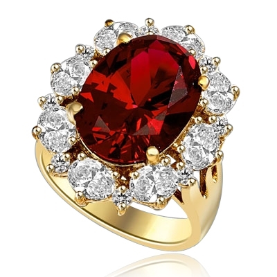 Gorgeous Ring with 8.25 Cts. Oval Cut Ruby Essence in center, surrounded by Oval cut Diamond Essence and Round Brilliant Melee. 10.25 Cts T.W. set in 14K Solid Yellow Gold.