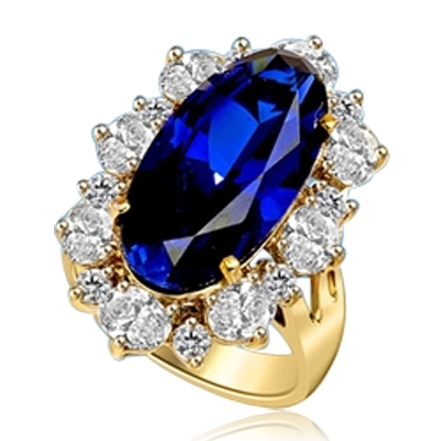Sapphire Ring - 13 Cts. Long Oval cut Sapphire Essence set in center surrounded by Oval Diamond Essence and Melee. 16.0 Cts. T.W. set in 14K Solid Yellow Gold.
