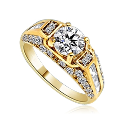 Engagement Ring- 1.0 Ct. round Brilliant Diamond Essence in center with Chanel set Baguettes and Melee going half way down the band. 2.0 Cts. T.W. set in 14K Solid Yellow Gold.