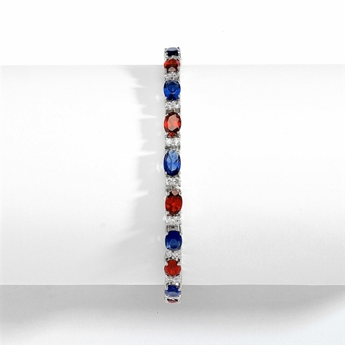 Perfect party wear. 7" long Diamond essence Platinum Plated Sterling Silver bracelet, in alternate setting of oval cut Sapphire Essence and Garnet Essence stones, 0.5 carat each in four prongs. Diamond Essence melee set in between for more dramatic look.