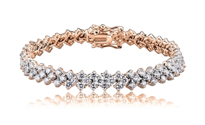 Diamond Essence 7" long dazzling bracelet. Round brilliant stones, 0.7 ct. each, set in four prong setting of Rose Plated Sterling Silver. 3 rows, 7 mm width, 8.5 cts.t.w. gives brilliant sparkle and just perfect party wear.