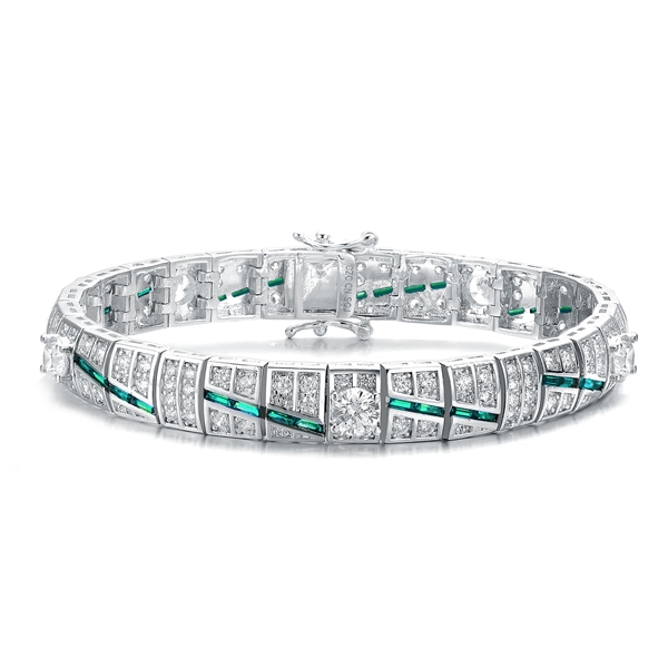 A stunner, this Platinum Plated Sterling Silver 7.25" bracelet features five round brilliant stones, 0.5 cts each, joined by melee and emerald baguettes . 14.0 cts. T.W.