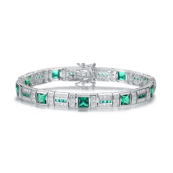 A stunner, this Platinum Plated Sterling Silver 7.25" bracelet features nine princess emerald stones, 0.25 cts each, joined by melee. 17.0 cts. T.W.