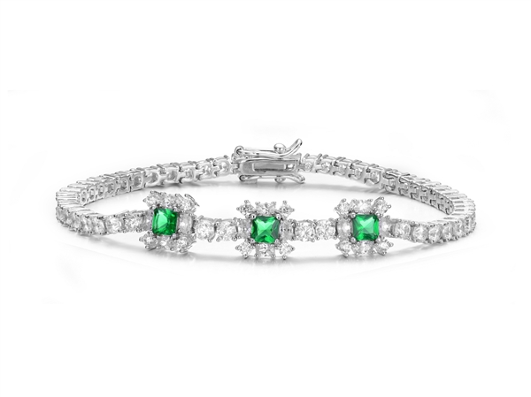 Beautiful Tennis Bracelet with Diamond Essence Brilliant Round, Oval and Green Princess stones set beautifully in the middle circled by accented flower inspired design.5.50 Cts.t.w in Platinum Plated Sterling Silver.