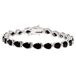 A beautiful bracelet, showing off 21 pear shape Diamond Essence Onyx stones, 0.75 ct. each, set in Platinum Plated Sterling Silver. 15.75 cts.t.w.