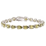 A beautiful bracelet, showing off 21 pear shape Diamond Essence Peridot stones, 0.75 ct. each, set in Platinum Plated Sterling Silver. 15.75 cts.t.w.