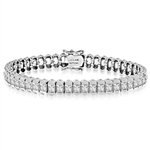 Platinum Plated Sterling Silver bracelet, 7" long, encompasses Diamond Essence Princess cut stones. 7.0 cts.t.w.