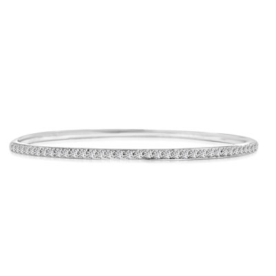 An alluring prong-set slip-on bangle bracelet for women with simulated round brilliant Diamonds by Diamond Essence set in platinum plated sterling silver. 4.50 Cts.t.w.