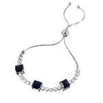 Diamond Essence Adjustable Bracelet with 1.0 ct. each Sapphire Princess cut stone in prong setting and 0.20 ct. each Round Brilliant stone in bezel setting. Beautiful bracelet  to fit on any size wrist. 8.0 Cts.T.W. in Platinum Plated Sterling Silver.