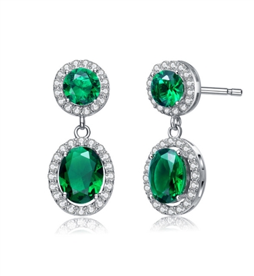 Emerald Essence 0.5 Ct. Round stones and 2.0 Cts. Oval cut stones, set in four prongs settings and surrounded by Diamond Essence Melee. Looks very attractive. 6.50 Cts.T.W. set in Platinum Plated Sterling Silver.