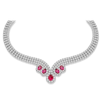 Magnificent Ruby Necklace. 3.0 Cts. Oval cut Ruby Essence in the center and 1.50 Cts. each Ruby Essence encircled by Diamond Essence stones. making 3 rows all around neckline. Special lock- on clasp to secure it. Just perfect to make any day a special day