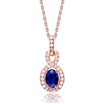 Designer Pendant with 1.0 CT Sapphire Essence in the center. Round brilliant melee on the bail and surrounding center stone with interwined design. 1.75 cts.t.w. in Rose Plated Sterling Silver. ( Matching Earring item# SEC6600SR)