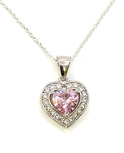 Heart shape Pink Essence stone in prong setting, is surrounded by round brilliant Diamond Essence stones, making another heart. 2.5 cts.t.w. in Platinum Plated Sterling Silver.