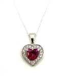 Heart shape Ruby Essence stone in prong setting, is surrounded by round brilliant Diamond Essence stones, making another heart. 2.5 cts.t.w. in Platinum Plated Sterling Silver.