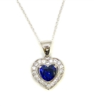 Heart shape Sapphire Essence stone in prong setting, is surrounded by round brilliant Diamond Essence stones, making another heart. 2.5 cts.t.w. in Platinum Plated Sterling Silver.