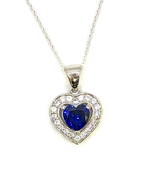 Heart shape Sapphire Essence stone in prong setting, is surrounded by round brilliant Diamond Essence stones, making another heart. 2.5 cts.t.w. in Platinum Plated Sterling Silver.
