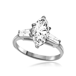 A 4.0 carats Diamond Essence Marquise cut stone in center with baguettes on each sides set in Platinum Plated Sterling Silver . 4.5 Cts. T.W.