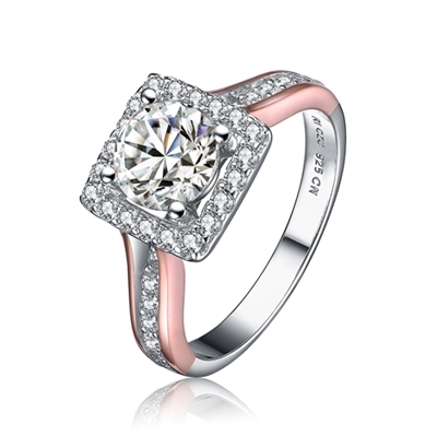 Diamond Essence Designer Ring in two tone.Center stone 1 ct. surrounded by Diamond Essence melee in square shape. 1.25 Cts. T.W. Ring is Platinum Plated Sterling Silver & rose gold plated over sterling silver. Approx dimension of square around center diam