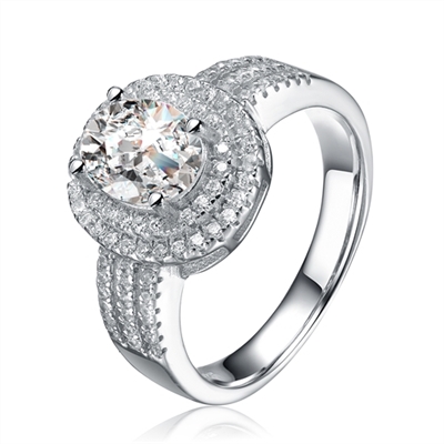 Diamond Essence Designer Ring with 2.5 carat Oval Essence center, surrounded by Round Essence melee in two rows around and three delicate rows on band for more elegance. 3.75 cts.t.w. in Platinum Plated Sterling Silver.