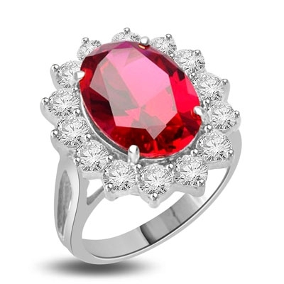 Princess Ring with 6.0 Cts. Oval cut Ruby Essence center surrounded by 14 Round Brilliant Diamond Essence stones 6.50 Cts. T.W. set in Platinum Plated Sterling Silver.