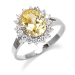 Light your Fire with this Cocktail Ring, 3.5 Cts T. W. with a 3 Cts. Oval Cut Diamond Essence Center and accents encircling the fireworks! In Platinum Plated Sterling Silver.