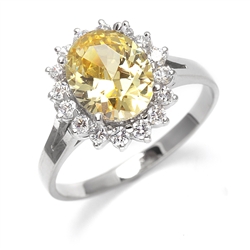 Light your Fire with this Cocktail Ring, 3.5 Cts T. W. with a 3 Cts. Oval Cut Diamond Essence Center and accents encircling the fireworks! In Platinum Plated Sterling Silver.