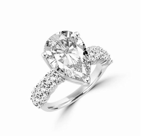 Majestic looking 6 carat Pear cut Diamond Essence stone and Round Brilliant stones on the band, 7.25 cts.t.w in Platinum Plated Over Sterling Silver.