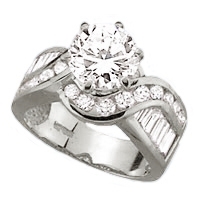 Diamond Essence Designer Ring With 2 Cts. Round Brilliant Set In Six Prongs And Brilliant Channel Set Baguettes And Melee On The Band In Platinum Plated Sterling Silver, 4 Cts.T.W.