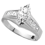 Diamond Essence Ring With 0.75 Ct. Marquise Center Followed By Channel Set Princess Stone Enhance the look Of Band In Platinum Plated Sterling SIlver, 1.50 Cts.T.W.