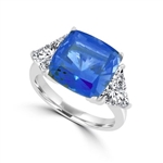 Sapphira - Fantastic Ring with a plush 4 Ct. Cushion Cut Sapphire Essence Masterpiece that highlights by each side of Trilliant accents.6 Cts. t.w. in Platinum Plated Sterling Silver , to chase your blues away!